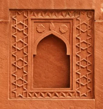 Decorative element - window on wall of an ancient palace. india, agra Stock Photos