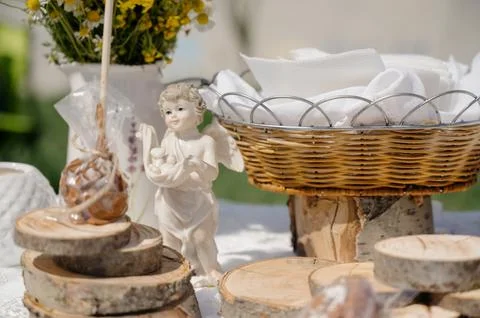 Decorative elements for the festive table: an angel figurine, a basket Stock Photos