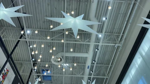 Decorative elements on modern shopping mall illuminated ceiling Stock Footage 144928915