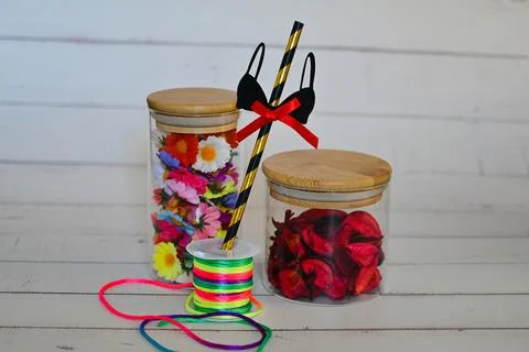 Decorative elements for various festive events are in glass jars 스톡 사진