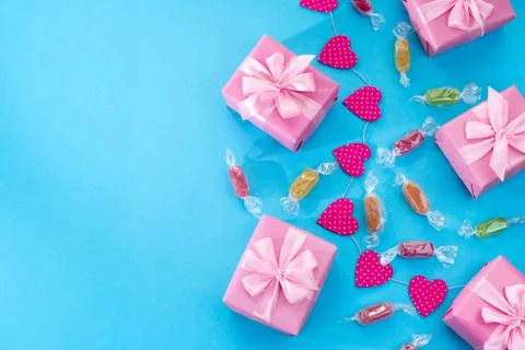 Decorative festive background with gift boxes. Stock Photos