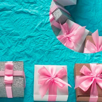 Decorative festive background with gift boxes. Stock Photos