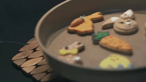 Decorative festive cookies in a pan with Easter themed icing elements Stock Footage 314653784