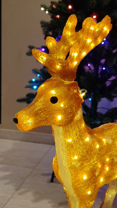 Decorative figurine of a glowing deer, close-up Stock Footage 322665137