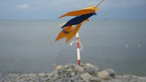 Decorative flags fluttering in the wind on the beach. Stock Footage 78487144