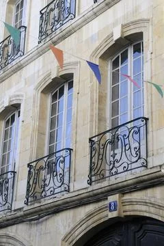 Decorative flags in front of windows, Nevers, Nivre, Burgundy, France Stock Photos