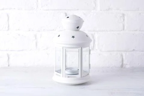 Decorative flashlight close-up on the background of a white brick wall, copy  Fotos de archivo