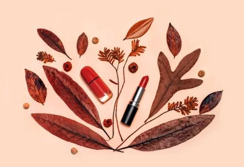 Decorative flat lay composition with cosmetics and Autumn leaves Stock Photos