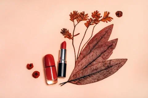 Decorative flat lay composition with cosmetics and Autumn leaves Stock Photos