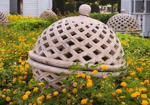 Decorative flower ceramics lantern elements  in the garden. landscape design  Stock Photos