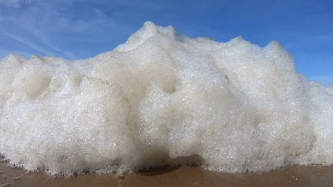 Decorative foam formations on the beach, North Sea Stock Footage 118228038