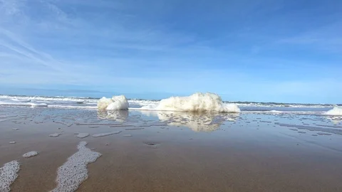 Decorative foam formations on the beach, North Sea Stock Footage 118228253