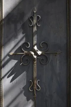 Decorative forged elements on rustic metal gate Stock Photos