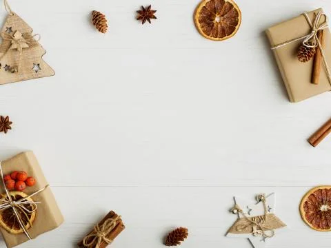 Decorative frame, christmas attributes on a white wooden table. Place for tex Stock Photos