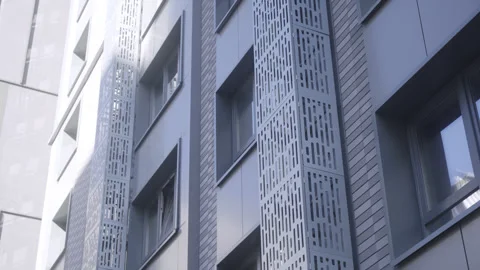 Decorative frames of mesh on multistory apartment building Stock Footage 330928163