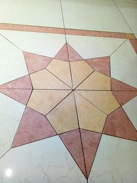 Decorative Geometric Ceramic Floor Tile Pattern in Interior Space Stock Photos