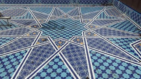 Decorative geometric mosaic pattern featuring shades of blue and white, sui.. Stock Photos