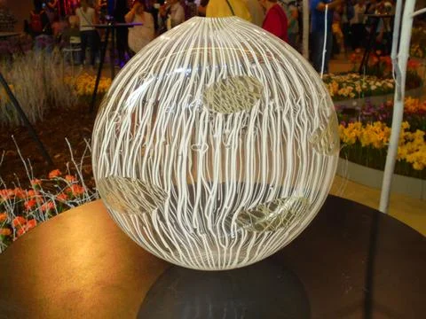 Decorative glass sphere with white threads at Flora exhibition, Olomouc 2019 스톡 사진