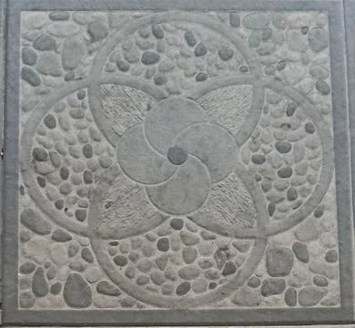Decorative Gray Pebble Stone Tile Texture With Circular Flower Pattern Stock Photos