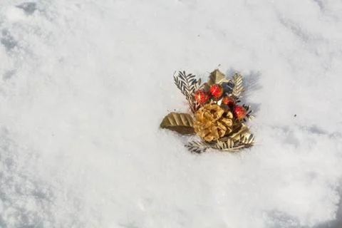 Decorative handiwork is lying on the snow. Stock Photos