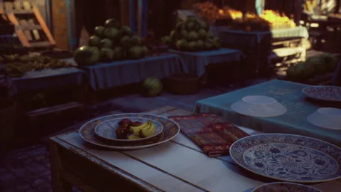 Decorative handmade pottery with vibrant blue designs visible in soft lighting Stock Footage 341831187