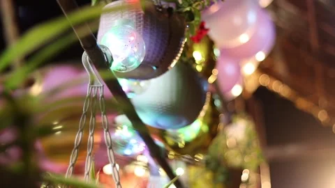 Decorative Hanging Flower Pots with Glowing LED Lights at Festive Night Event Stock Footage 334774537