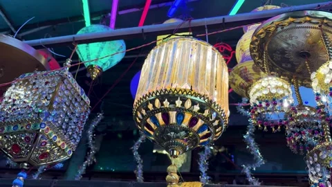 Decorative hanging lanterns displayed at festive market stall for retail sale 스톡 동영상 321348976