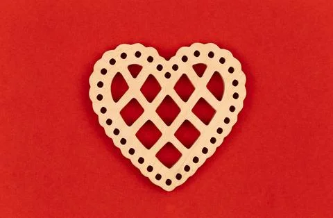 Decorative heart on a red background, flat lay, conceptual minimalism. Stock Photos