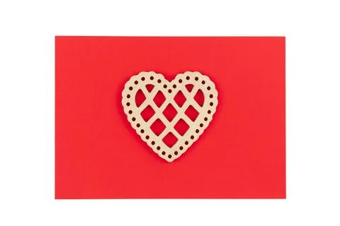 Decorative heart on a red background, flat lay, conceptual minimalism. Stock Photos