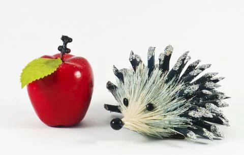 Decorative hedgehog with apple Stock Photos