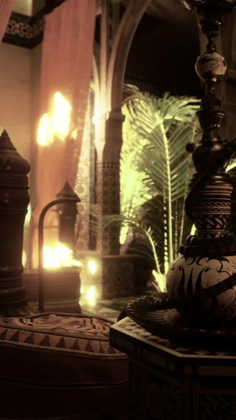 Decorative hookah setup in a dimly lit room with warm lighting Stock Footage 331753018