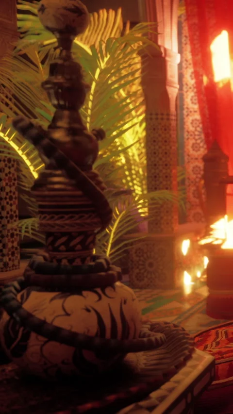 Decorative hookah sits on a table in a vibrant café at night Stock Footage 339510345
