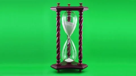 Decorative Hourglass Time-lapse over green. Stock Footage 7186798
