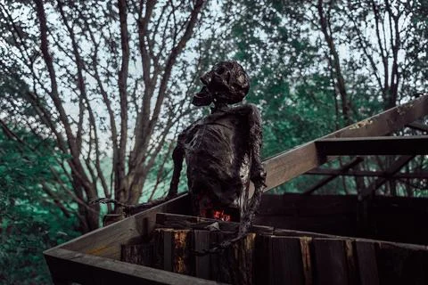 Decorative human corpse. The body is attached to a wooden structure in nature Stock Photos