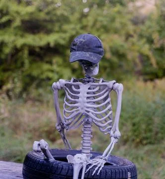Decorative human corpse. The body is attached to a wooden structure in nature Stock Photos