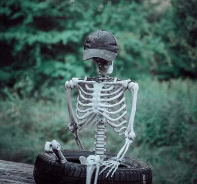 Decorative human corpse. The body is attached to a wooden structure in nature Stock Photos