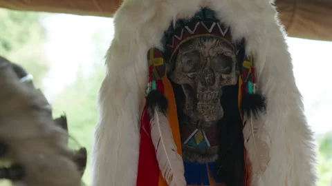 A decorative human skull with carved patterns and a fur hat Stock Footage 314213354