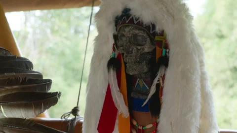 A decorative human skull with carved patterns and a fur hat Stock Footage 314213489