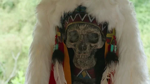 A decorative human skull with carved patterns and a fur hat Stock Footage 314213655