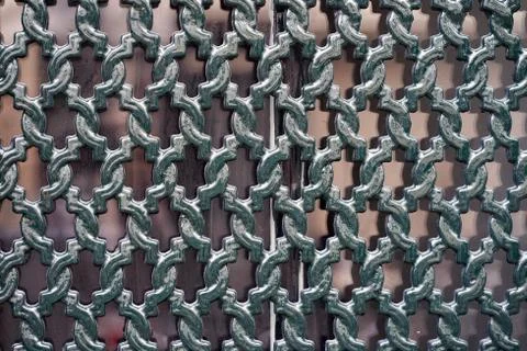 Decorative iron grating on the window Stock Photos