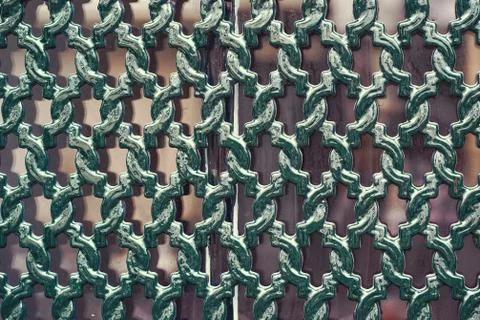 Decorative iron grating on the window Stock Photos