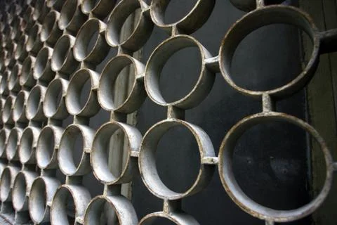 Decorative iron window pattern, metal protection on the window, metal net cir Stock Photos