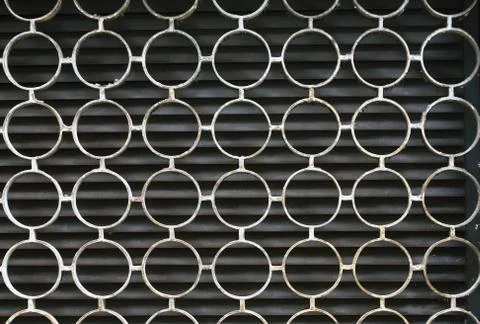 Decorative iron window pattern, metal protection on the window, metal net cir Stock Photos