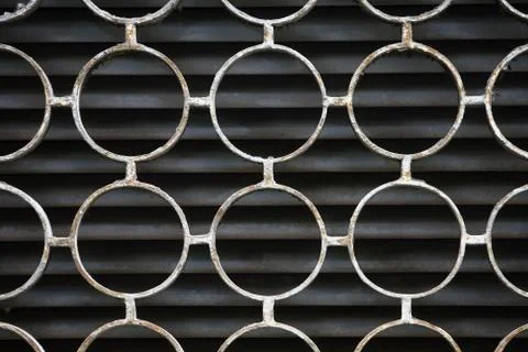 Decorative iron window pattern, metal protection on the window, metal net cir Stock Photos