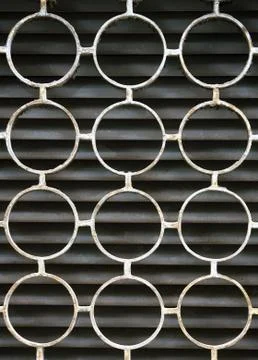 Decorative iron window pattern, metal protection on the window, metal net cir Stock Photos