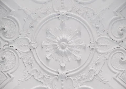 Decorative item ceiling socket made of white plaster. Relief stucco interior Stock Photos