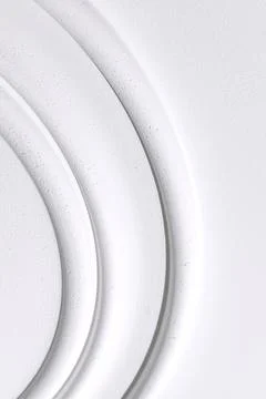 Decorative item made of white plaster on ceiling close-up. Relief stucco in.. Stock Photos