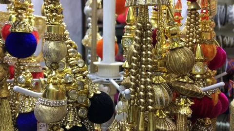 Decorative items for dress material is displaying in a shop Stock Footage 100495218