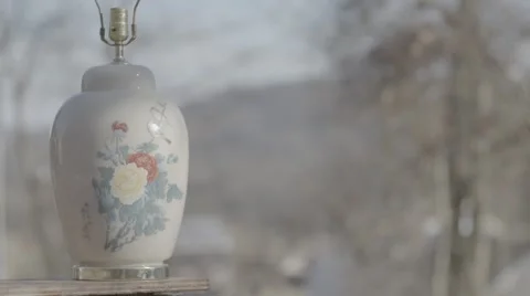 Decorative lamp getting smashed with a 2x4, slow motion Stock Footage 61941269