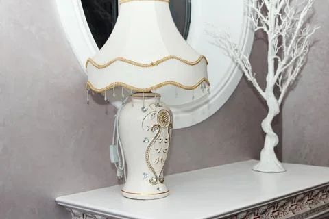 Decorative lamp on ornate table with elegant accents Stock Photos